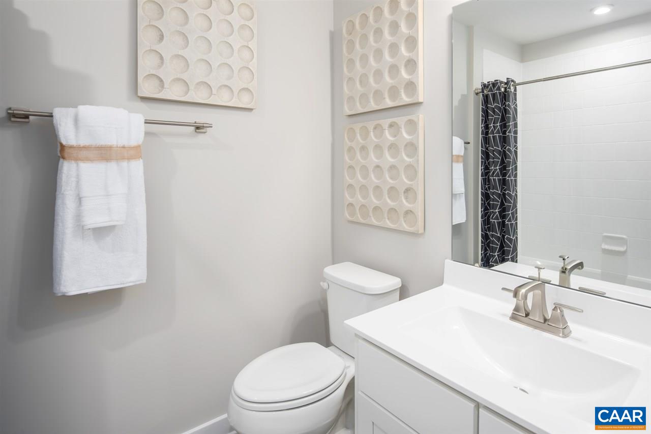 363 Winding Road Keswick, VA 22947 - Photo 24 of 24 a bathroom with a toilet a sink and a mirror