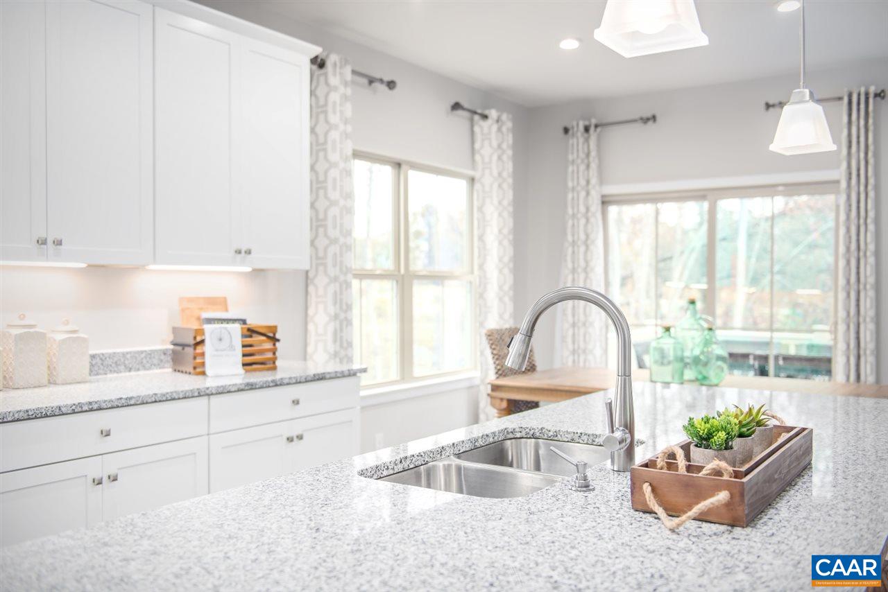 363 Winding Road Keswick, VA 22947 - Photo 5 of 24 a kitchen with granite countertop a sink and a stove top oven