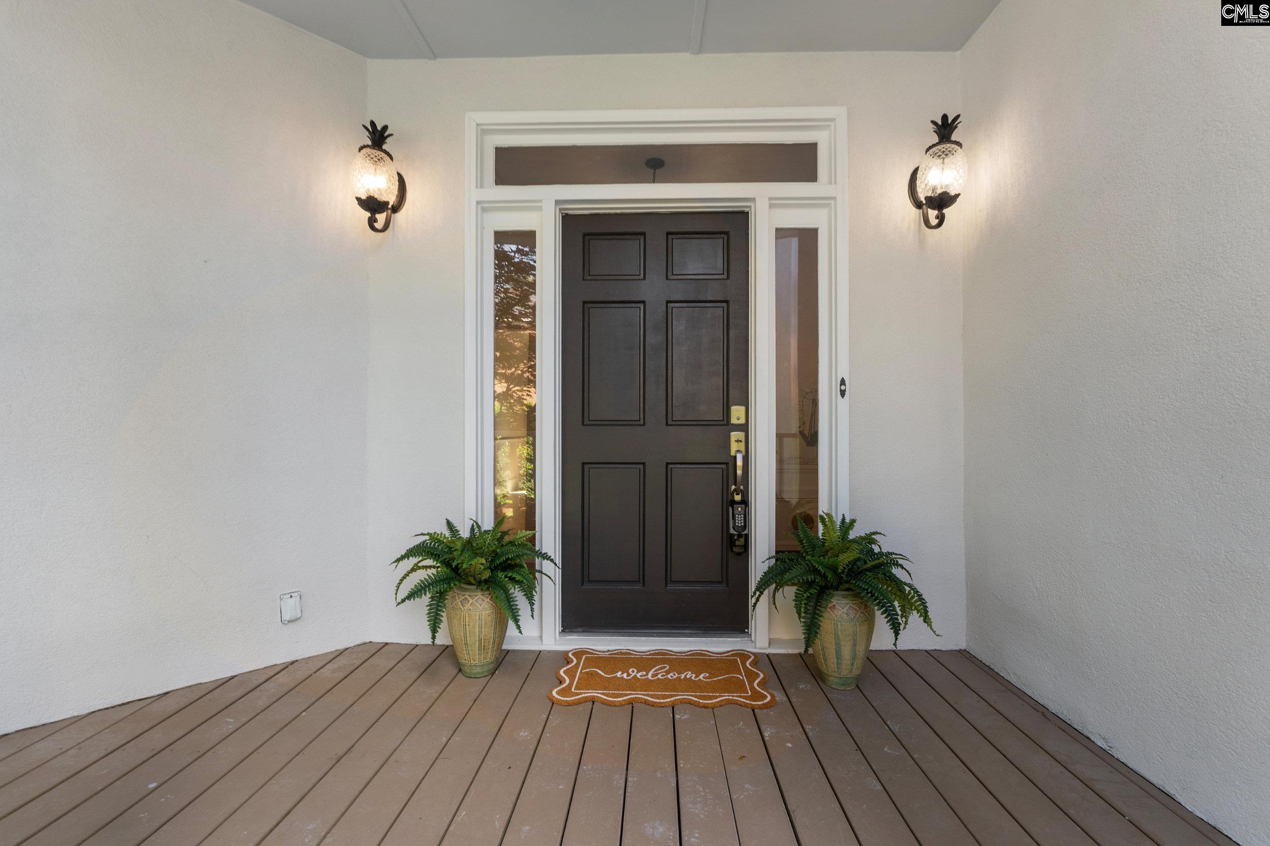 121 Silver Lake Road East Columbia, SC 29223 - Photo 3 of 57 a view of a hallway with wooden floor and a potted plant
