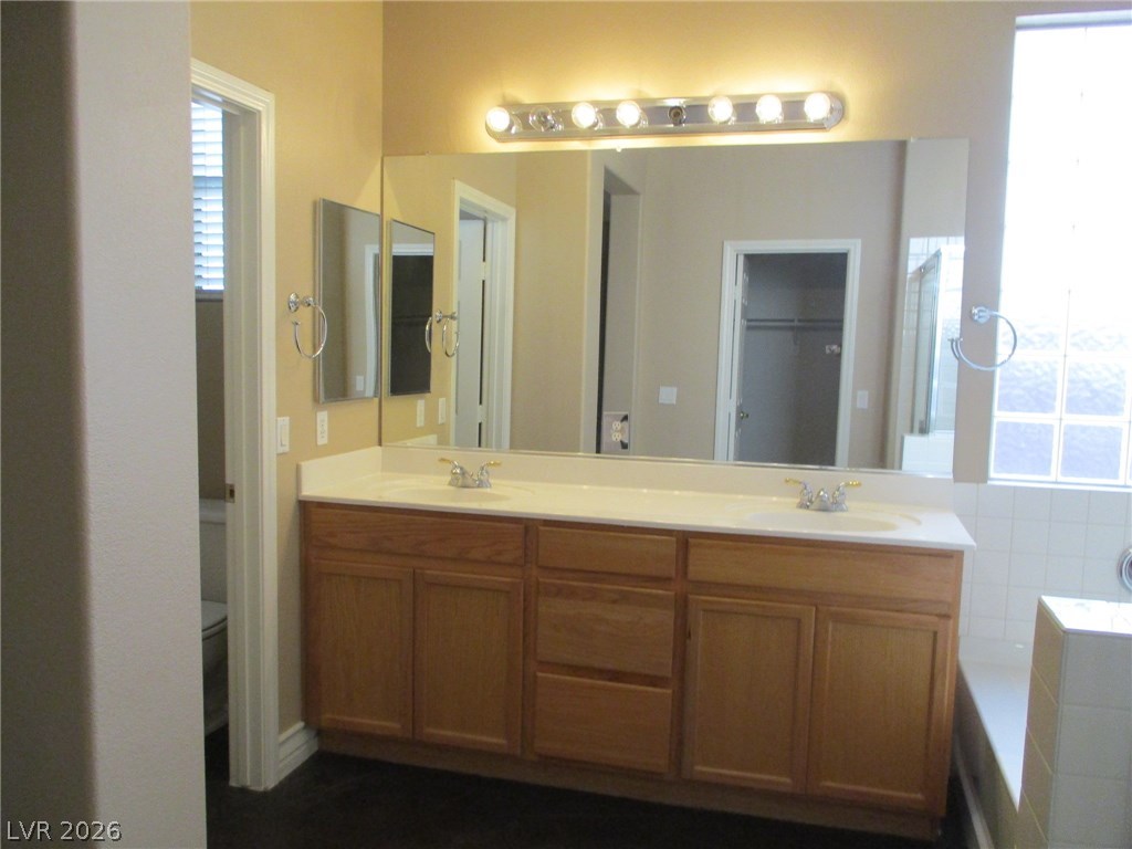 2435 Carnegie Hall Street Las Vegas, NV 89135 - Photo 14 of 25 Dual sinks and separate water closet.