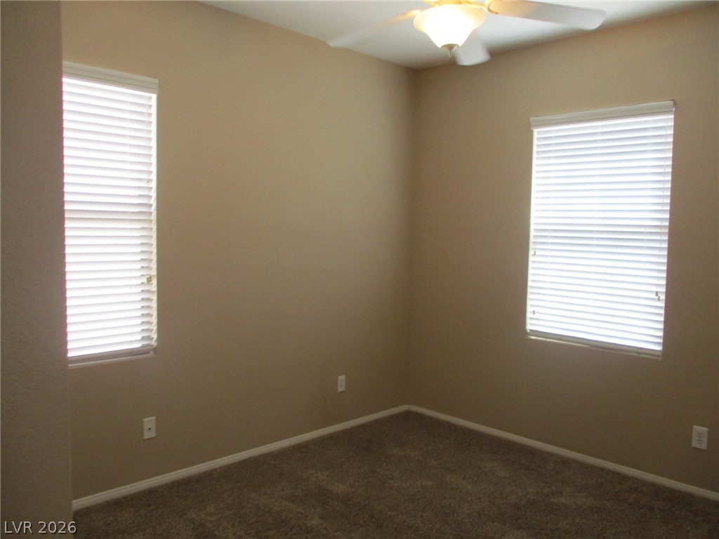 2435 Carnegie Hall Street Las Vegas, NV 89135 - Photo 21 of 25 Bedroom 2 with ceiling fan and light.