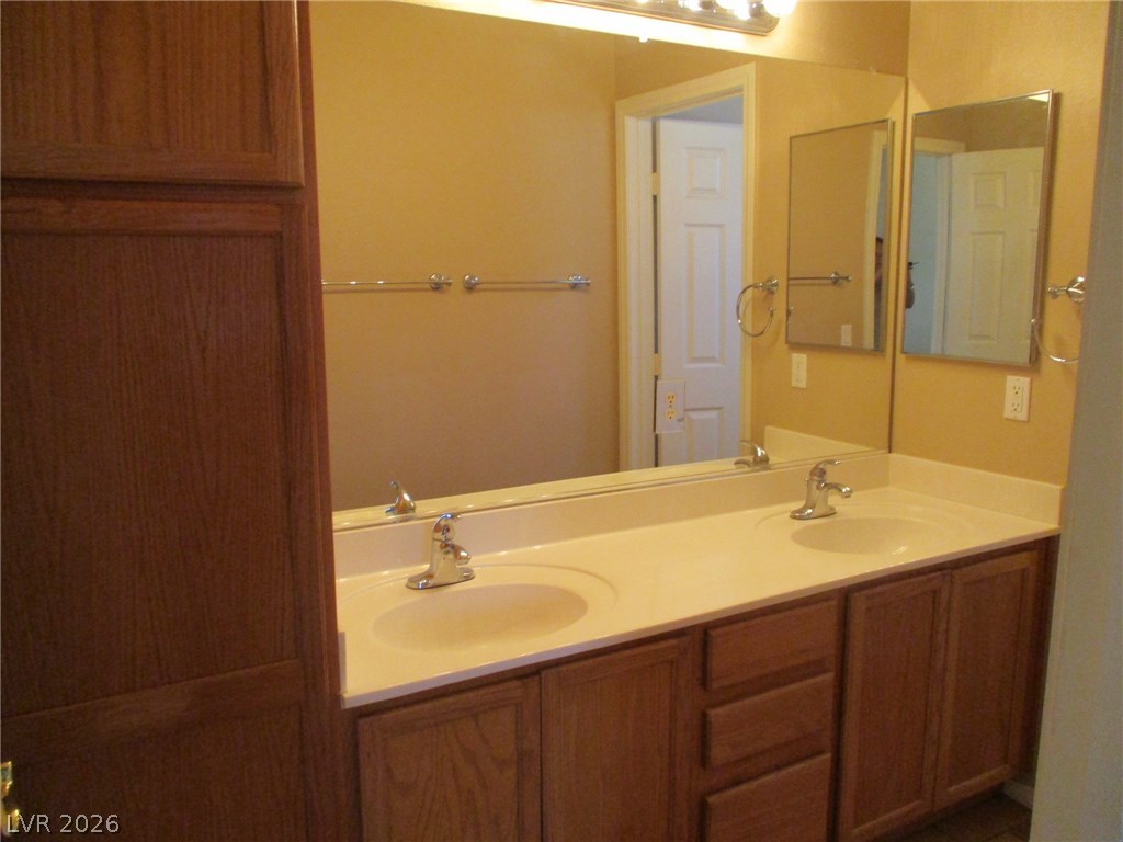 2435 Carnegie Hall Street Las Vegas, NV 89135 - Photo 22 of 25 Bath upstairs with dual sinks and separate from tub/shower..