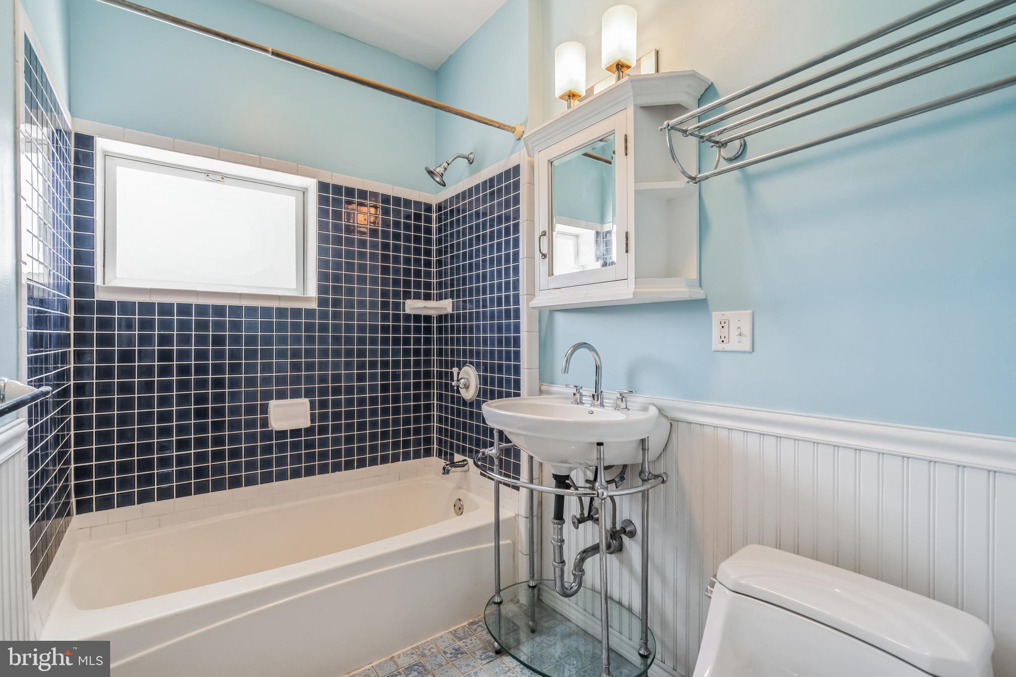126 Ripka Street Philadelphia, PA 19127 - Photo 16 of 30 a bathroom with a sink a bathtub and a shower