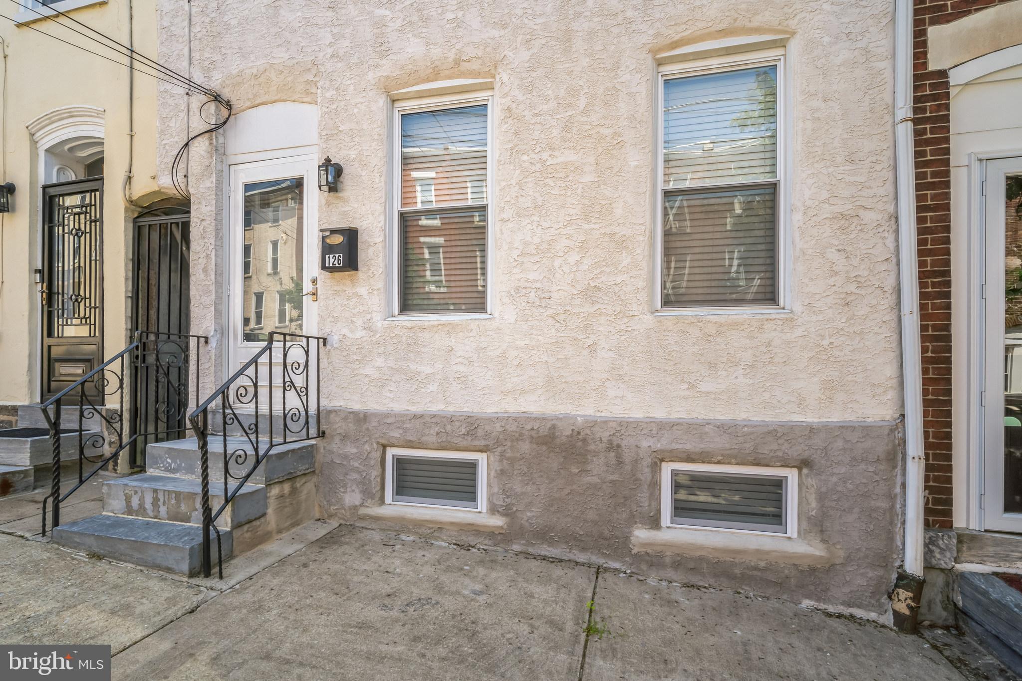 126 Ripka Street Philadelphia, PA 19127 - Photo 2 of 30 a view of a brick house with many windows