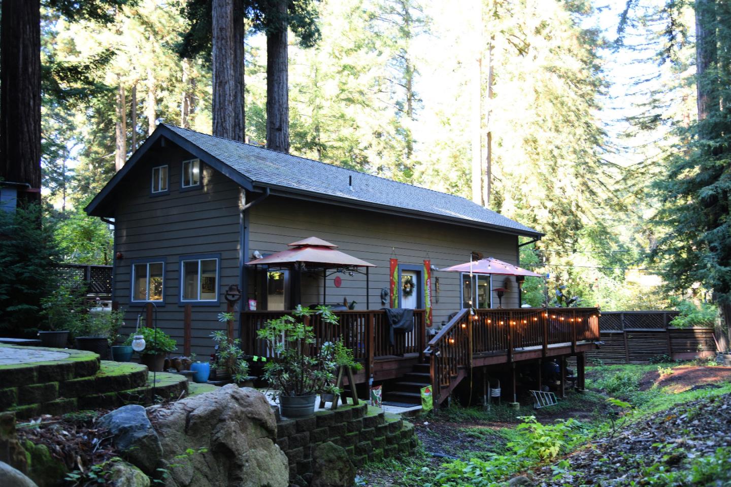 a view of house with a chairs and table in a patio
