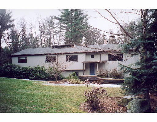 91 Hunters Ridge Road Concord, MA 01742 - Photo 1 of 1 a view of a house with a yard