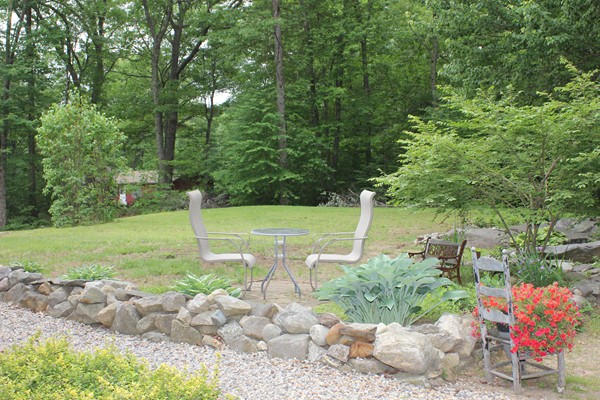 110 School House Road Phillipston, MA 01331 - Photo 21 of 22 a view of a garden with a bench