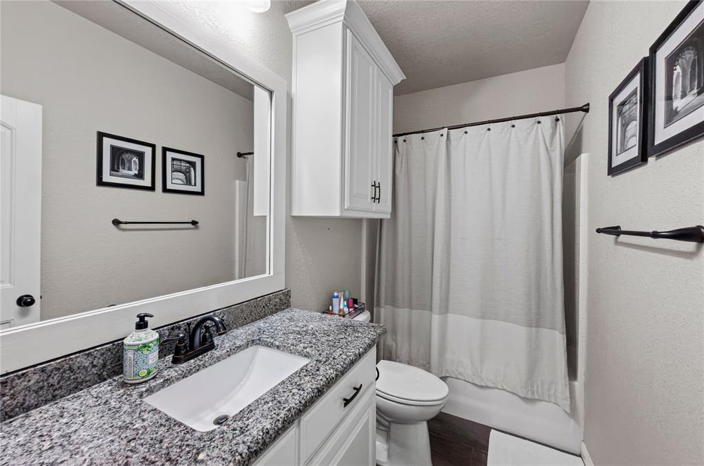 6093 Farm To Market Road 730 North Decatur, TX 76234 - Photo 15 of 28 a bathroom with a granite countertop sink toilet and shower
