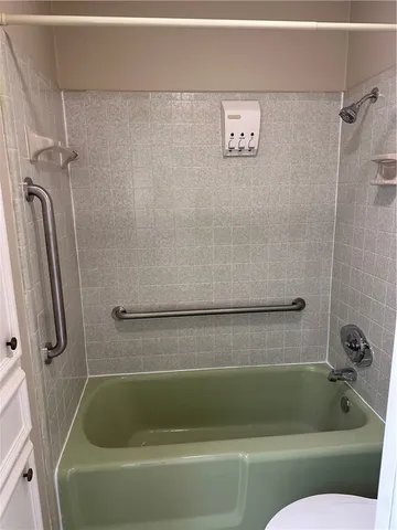 a bathroom with a shower and a bathtub