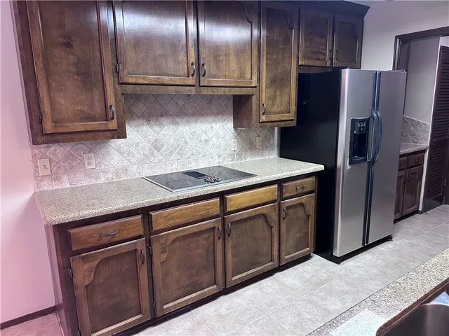 a view of an empty room with a chandelier