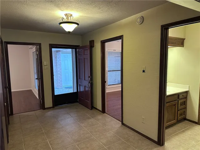 a bathroom with a sink vanity tub and shower