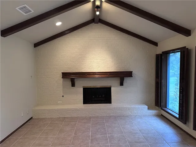 a living room with a fireplace