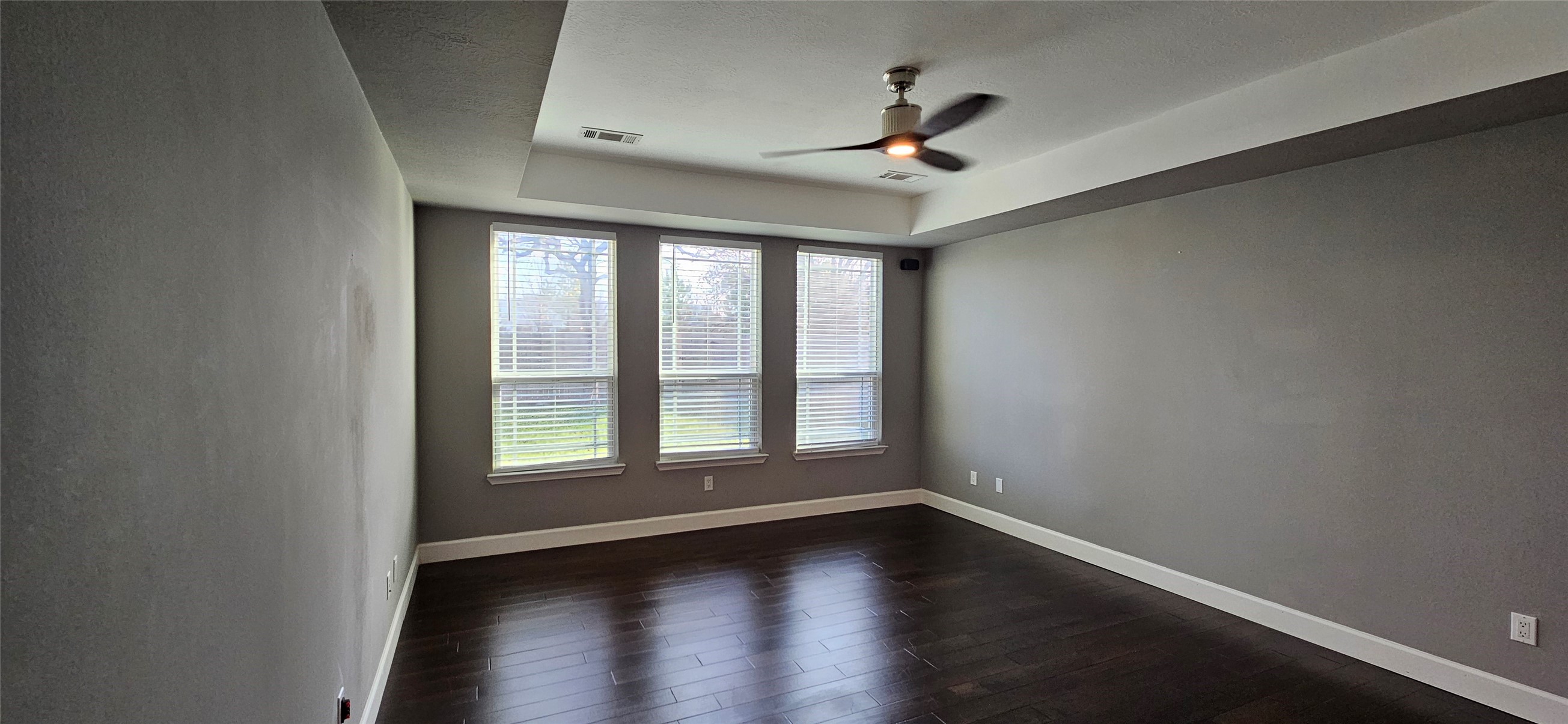 13035 Bainbridge Trail Houston, TX 77065 - Photo 11 of 31 a view of an empty room with wooden floor and a window