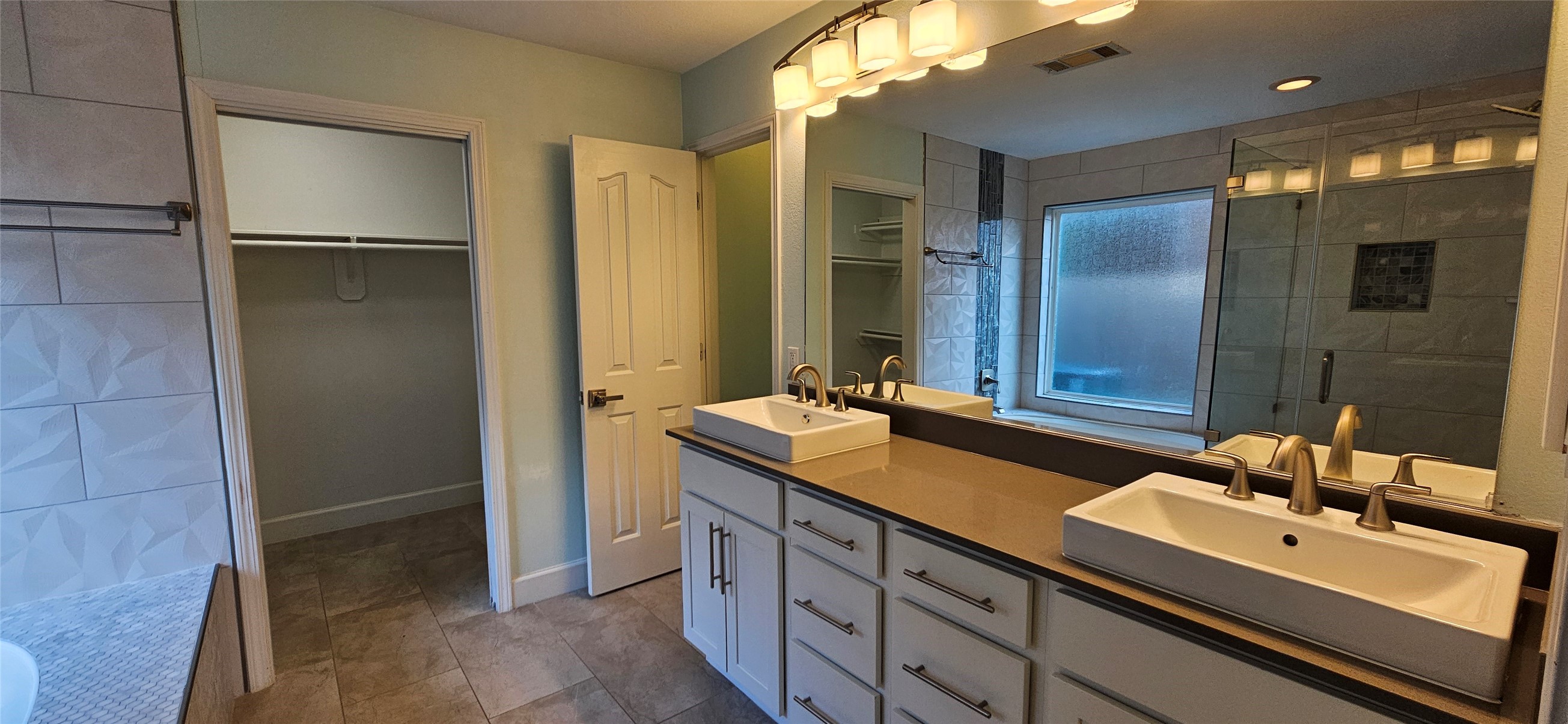 13035 Bainbridge Trail Houston, TX 77065 - Photo 13 of 31 a bathroom with a double vanity sink and mirror