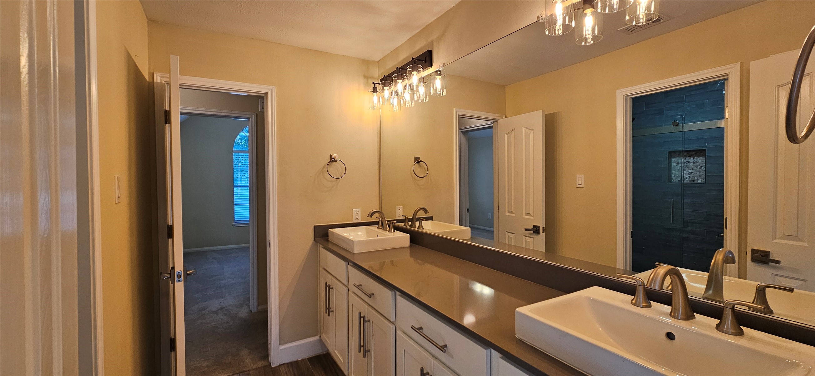 13035 Bainbridge Trail Houston, TX 77065 - Photo 21 of 31 a bathroom with a double vanity sink mirror and double
