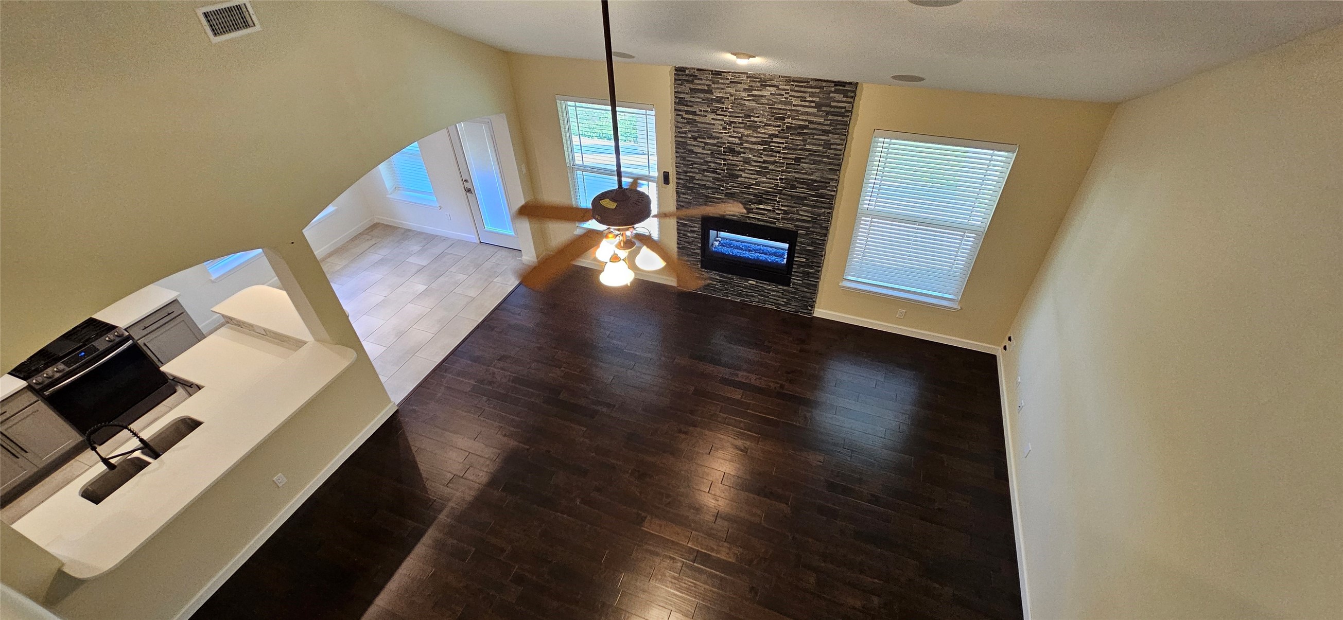 13035 Bainbridge Trail Houston, TX 77065 - Photo 24 of 31 an empty room with wooden floor wooden floor and windows