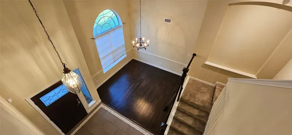 a view of staircase with wooden floor