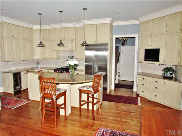 2509 Sharon View Lane Raleigh, NC 27614 - Photo 9 of 25 Custom Floor to Ceiling Kitchen Cabinets, Tile Backsplash, Walk In Pantry, Built In TV.