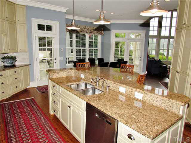 2509 Sharon View Lane Raleigh, NC 27614 - Photo 10 of 25 Gourmet Kitchen includes: Stainless Steel Appliances, Wolf Range, Double Ovens, Pot Filler, Sub Zero, Wine Frig, Warming Drawer, Custom Cabinetry, Beautiful Granite tops.
