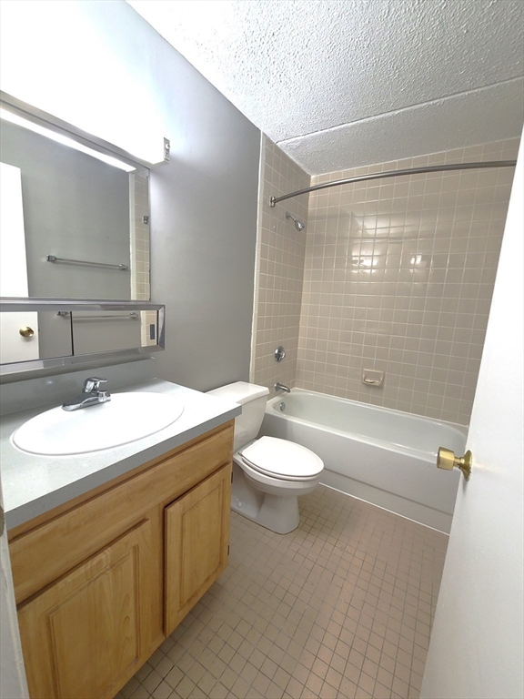 1 South Point Drive, Unit 404 Boston, MA 02125 - Photo 11 of 15 a bathroom with a sink a toilet and shower