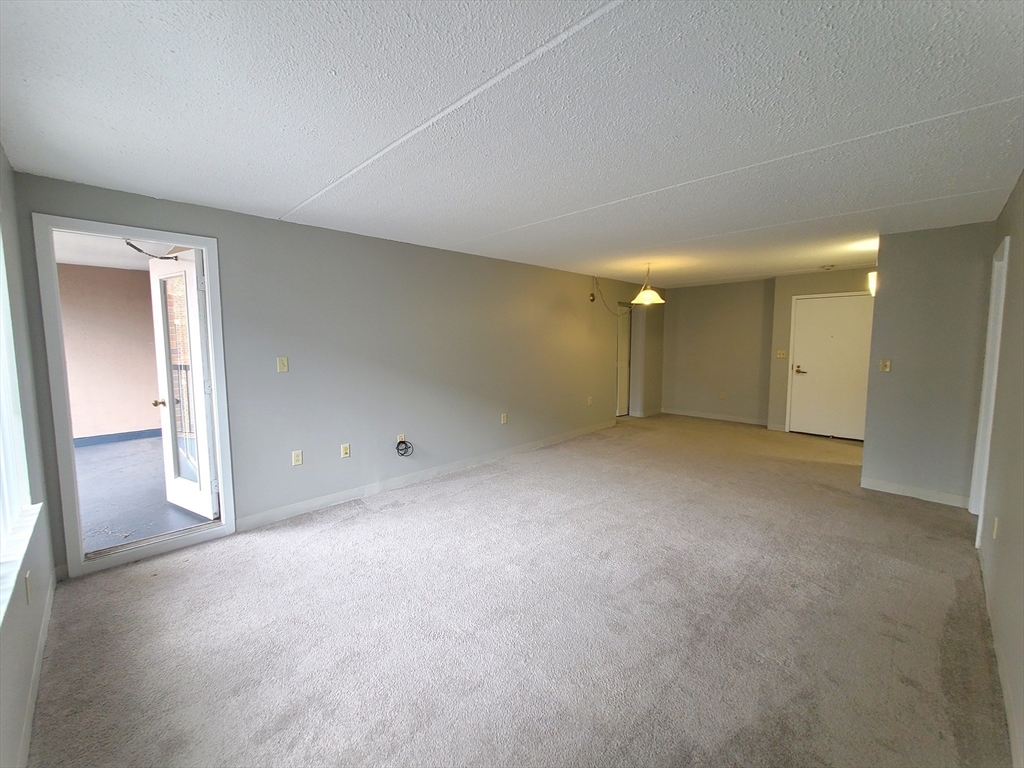 1 South Point Drive, Unit 404 Boston, MA 02125 - Photo 2 of 15 a view of empty room