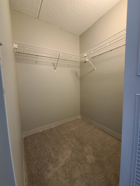 1 South Point Drive, Unit 404 Boston, MA 02125 - Photo 7 of 15 a view of a room with racks on the wall