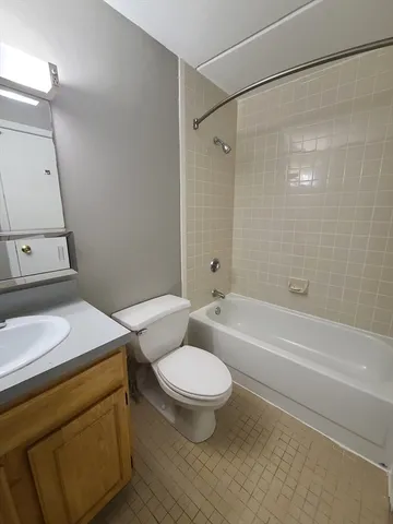 a bathroom with a sink a toilet and a bathtub