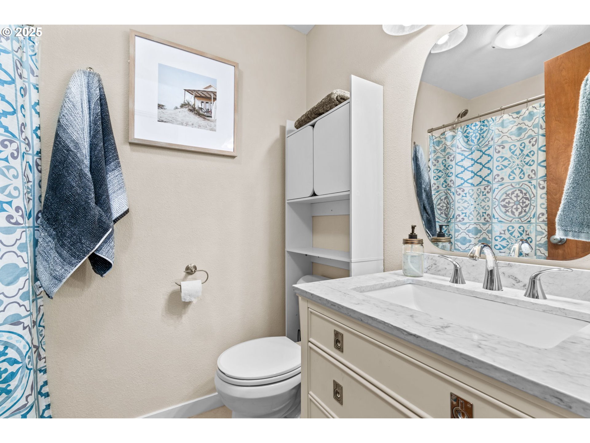 1490 Carobelle Court Cottage Grove, OR 97424 - Photo 14 of 28 a bathroom with a granite countertop sink mirror vanity and toilet