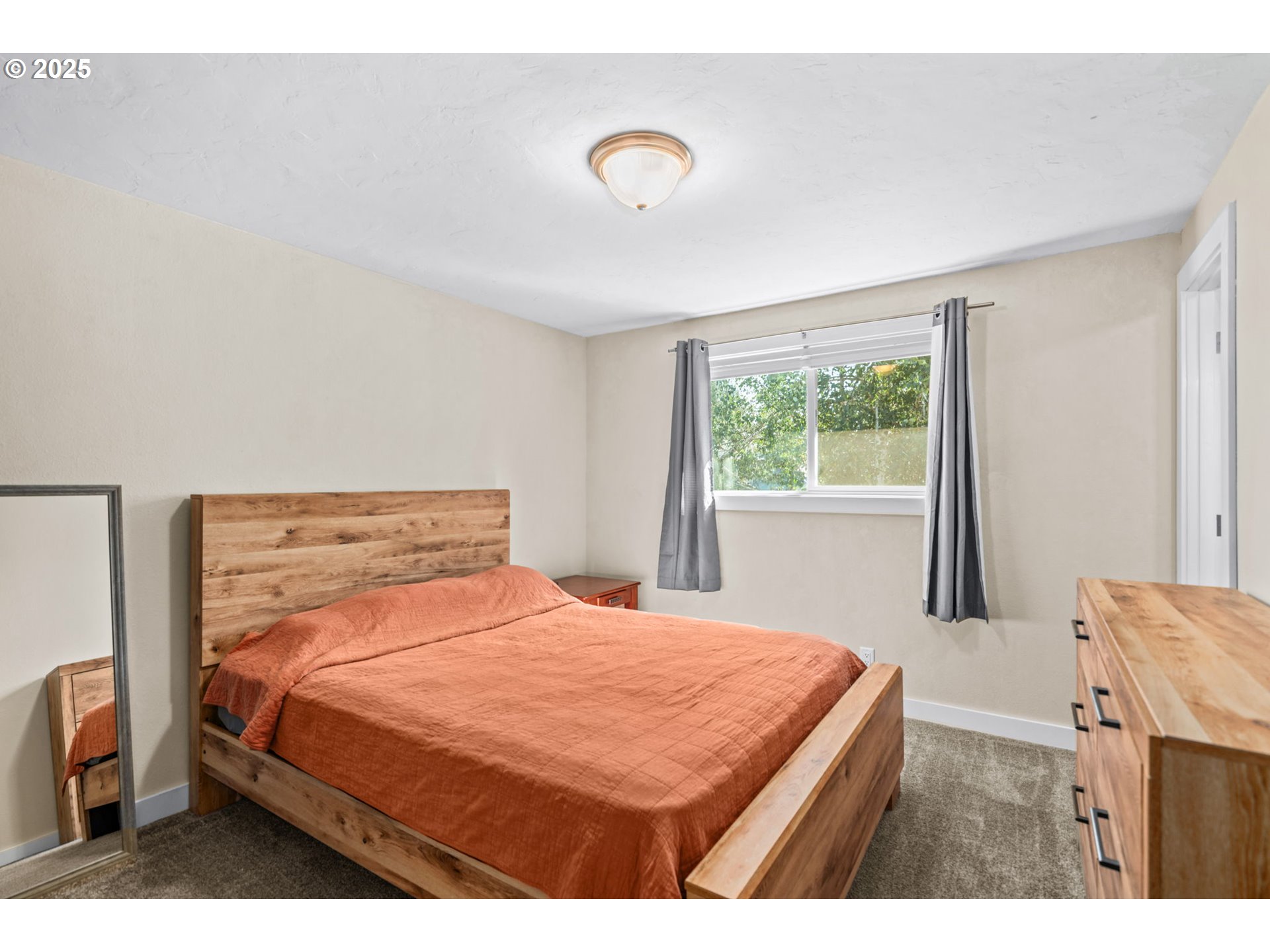 1490 Carobelle Court Cottage Grove, OR 97424 - Photo 15 of 28 a bedroom with a bed and a large window