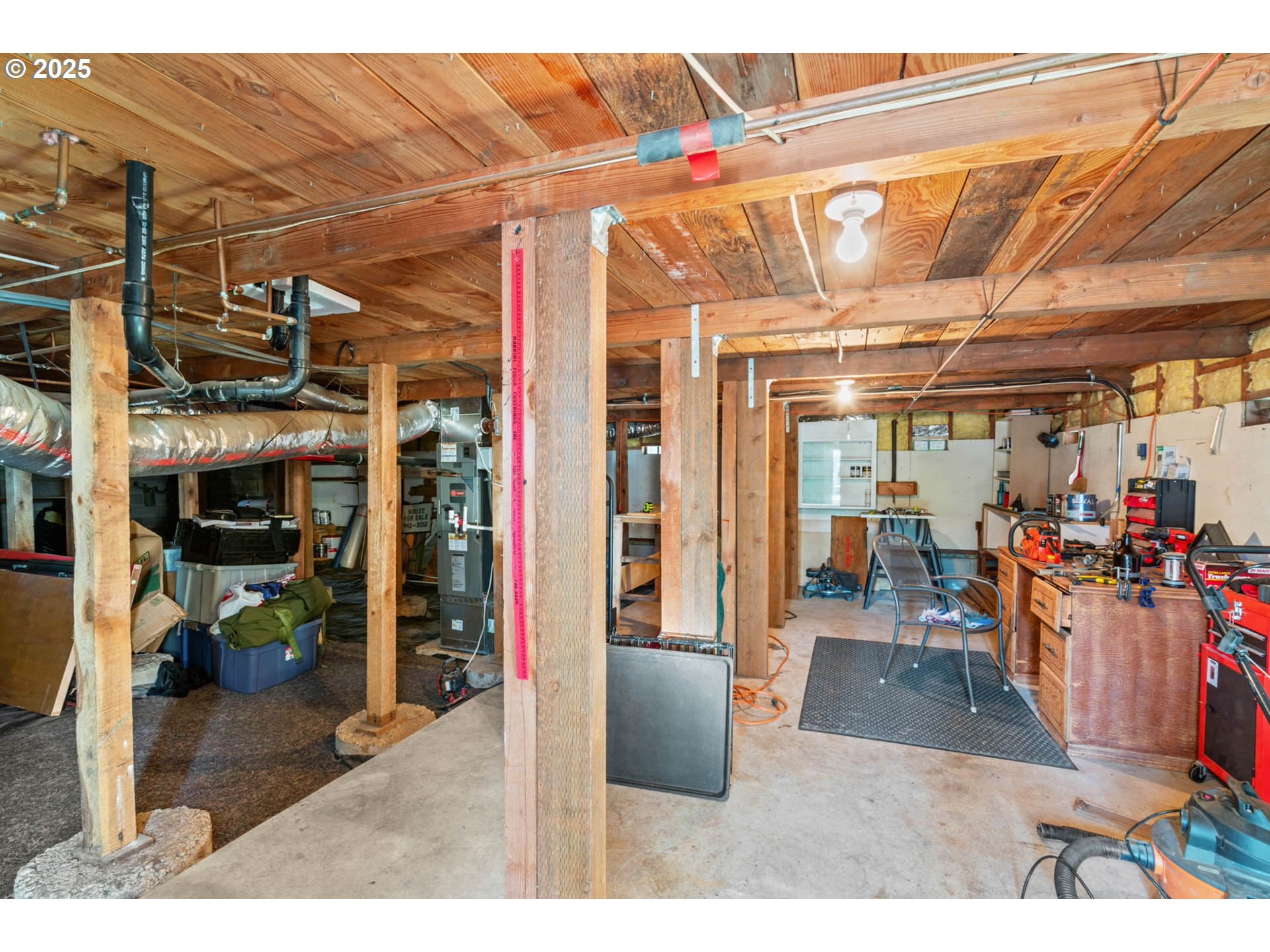 1490 Carobelle Court Cottage Grove, OR 97424 - Photo 20 of 28 a view of a garage with a table and chairs