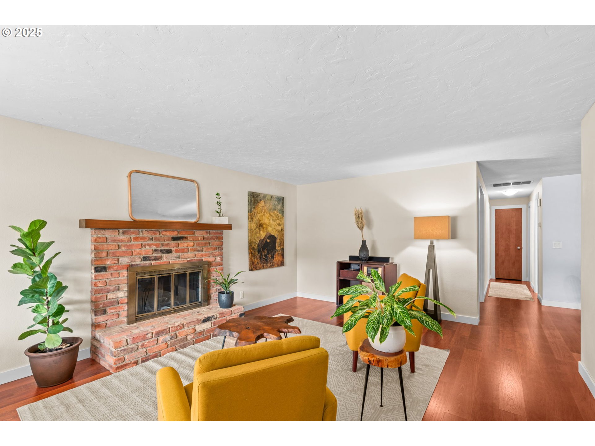 1490 Carobelle Court Cottage Grove, OR 97424 - Photo 5 of 28 a living room with furniture a potted plant and a fireplace