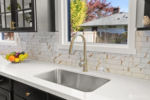 a kitchen with a sink and a window
