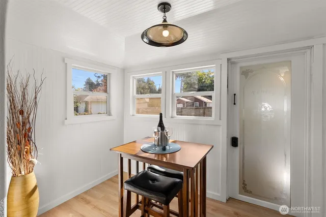 a view of a dining room with furniture window and wooden floor