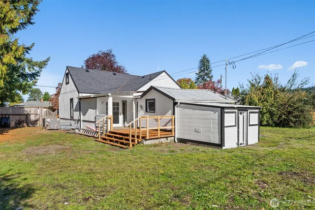 a front view of house with a garden