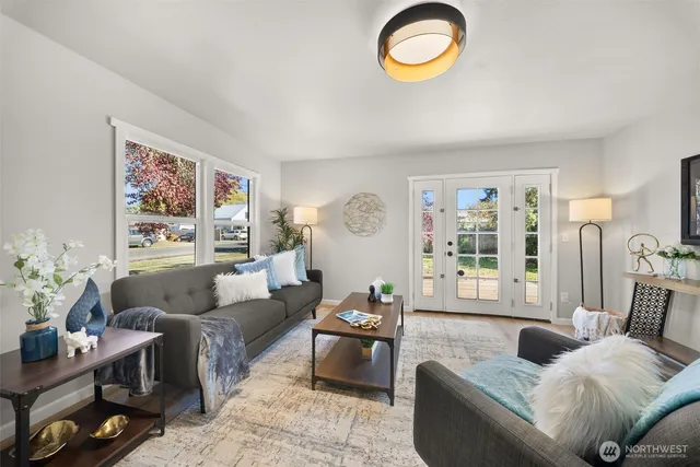 a living room with furniture and a large window