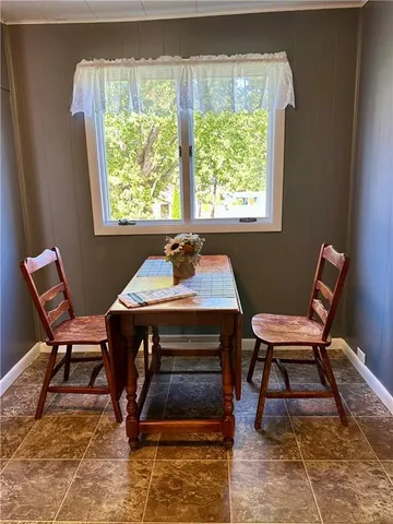a work room with furniture and a window