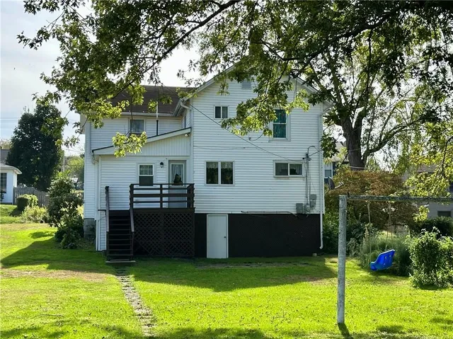 a view of a house with a backyard