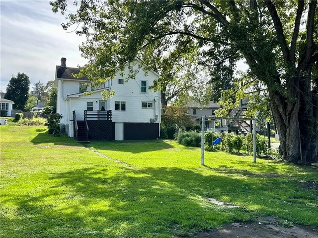a view of a house with a backyard