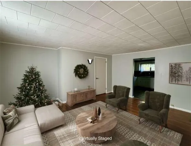 a living room with furniture and a mirror