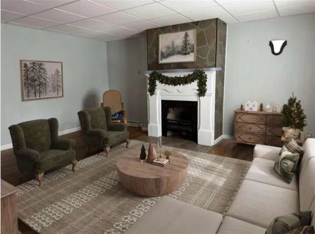 a living room with furniture and a fireplace