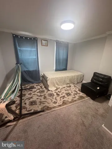 a bedroom with a bed and a mirror