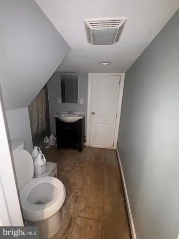 a bathroom with a sink and toilet