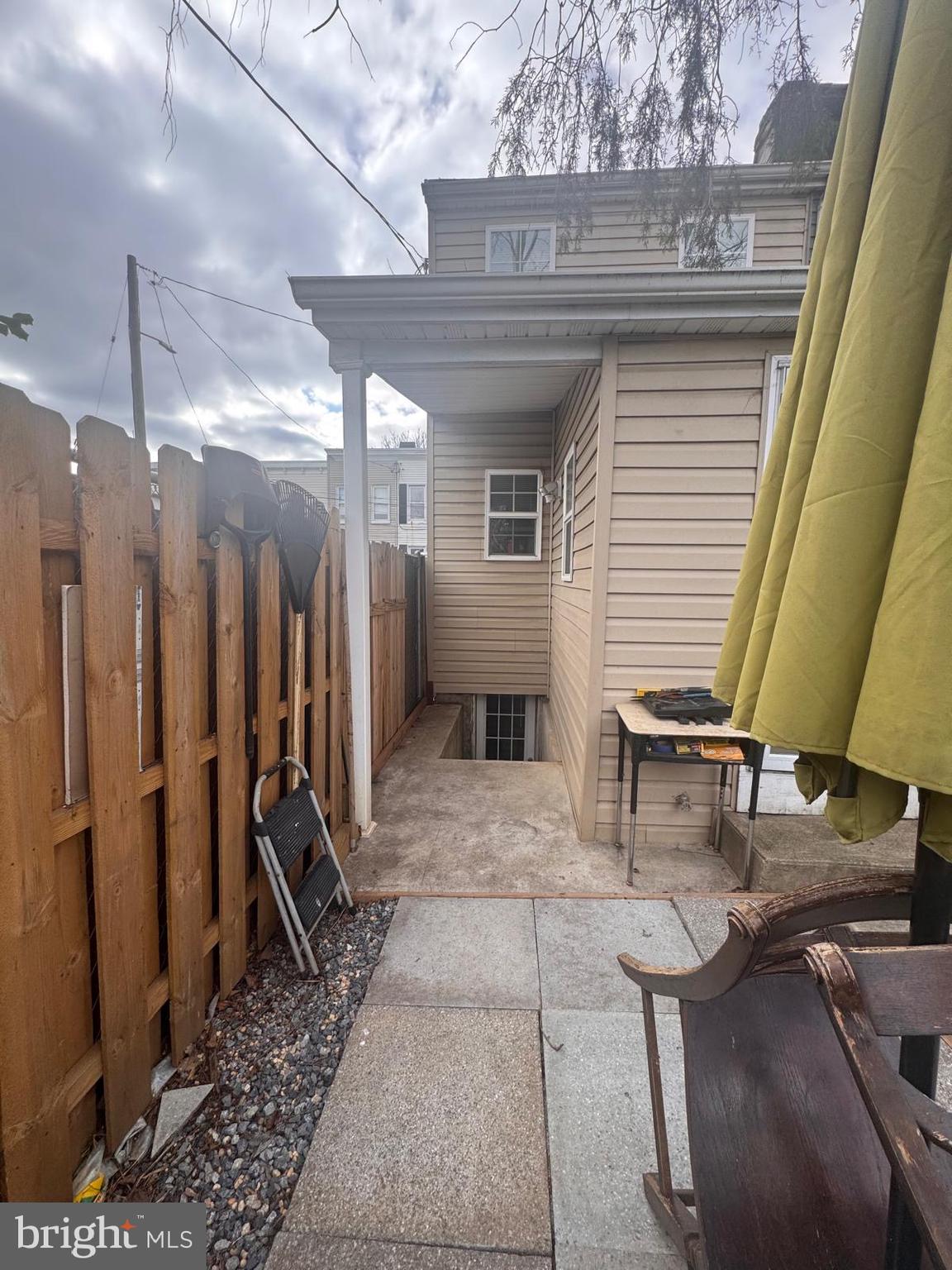 424 Freeman Street Baltimore, MD 21225 - Photo 22 of 23 a view of a porch with a table and chairs