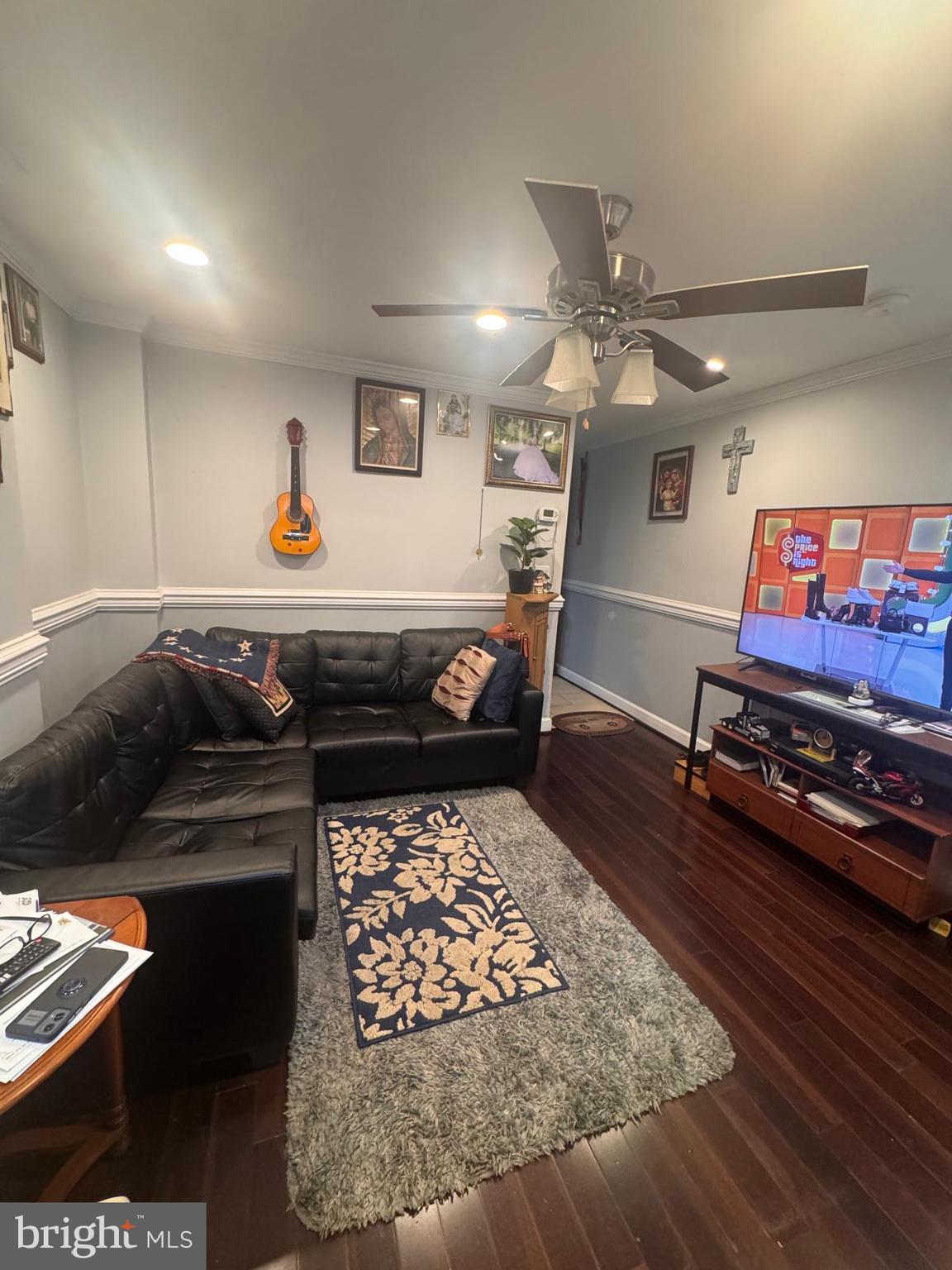 424 Freeman Street Baltimore, MD 21225 - Photo 3 of 23 a living room with furniture and a flat screen tv