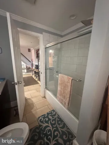 a bathroom with a bathtub and toilet