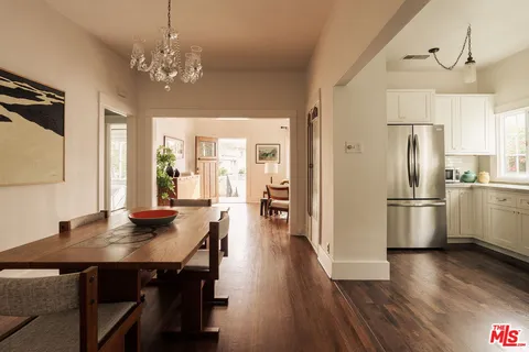 a view of a hallway with a wooden door