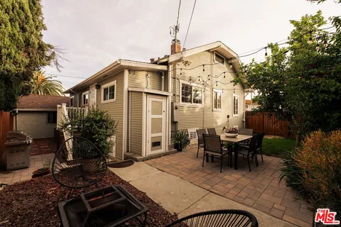 a view of a chairs and table in patio