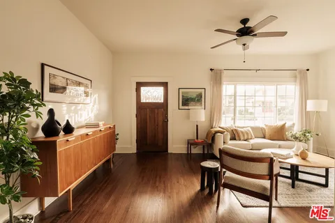 a bedroom with furniture and a window