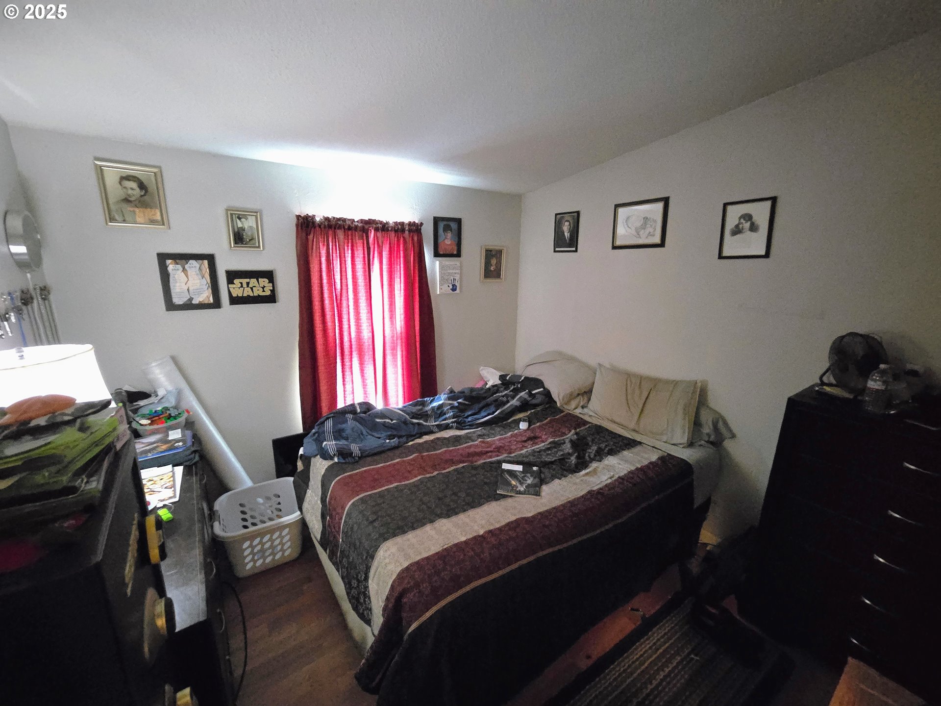 3200 Oak Terrace Drive, Unit 47 Lebanon, OR 97355 - Photo 12 of 24 a bedroom with a bed and wooden floor