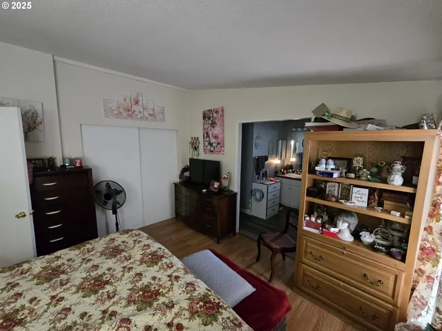 a bedroom with a bed and a dresser